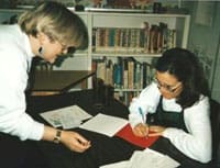 Kathy Stinson signing one of her books for a fan